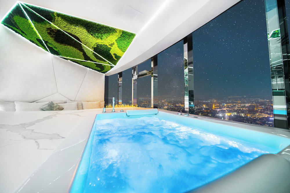 Hotel Apartments In Sky Tower With Bathtub Near The Window
